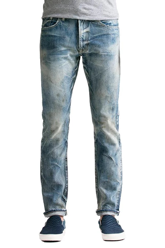 S.M.N Studio's Mercer in Coppola Men's Slim Fit Jeans - Light Vintage Indigo washed japanese cotton selvedge denim with fades honeycomb whiskering and paint/oil splatter effects 