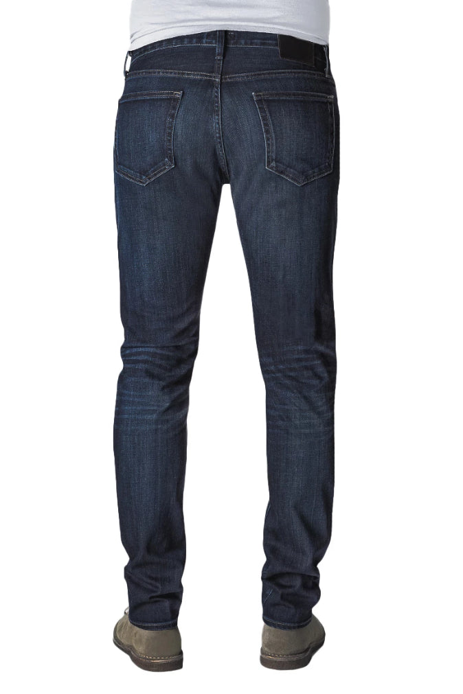 Back of S.M.N Studio's Hunter in Bowery Men's Jeans. Slim dark blue washed stretch jeans with lightly accenting contrast fades. 