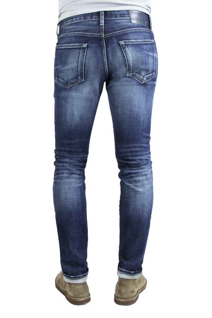 Back of S.M.N Studio's Finn in Matteo Men's Jeans - Tapered slim fit jean in comfort stretch premium Japanese selvedge denim in a dark blue wash with contrasting fades