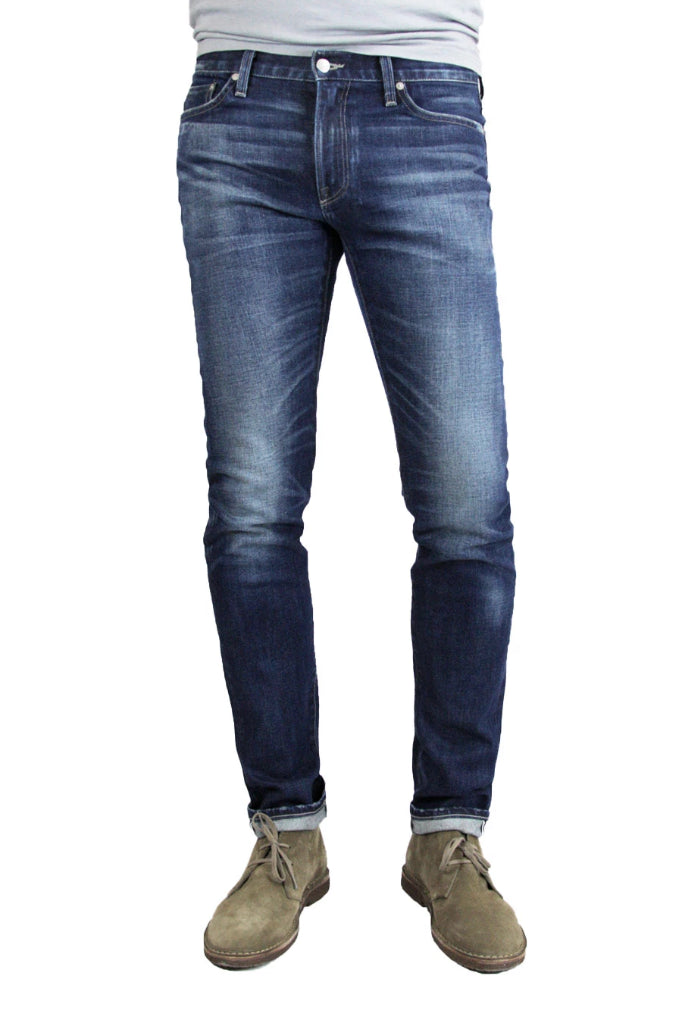 S.M.N Studio's Finn in Matteo Men's Jeans - Tapered slim fit jean in comfort stretch premium Japanese selvedge denim in a dark blue wash with contrasting fades