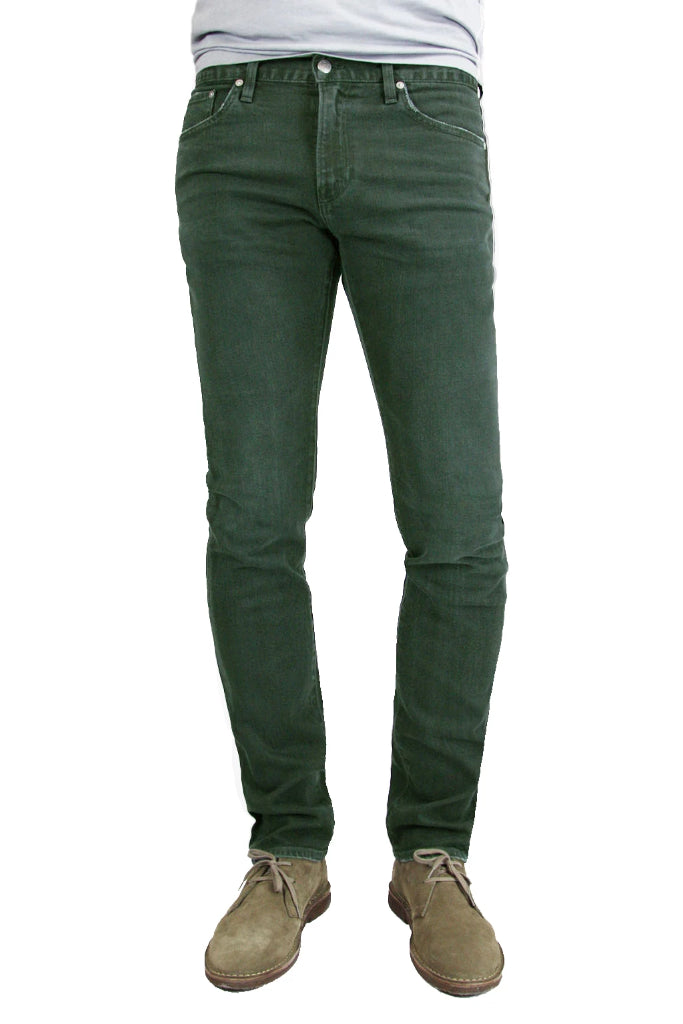 S.M.N Studio's Finn in Forest Men's Jeans - A tapered slim fit men's jean dyed in a forest green and made in premium stretch Japanese denim for slight contrast fades and whiskering for a lightly worn-in look