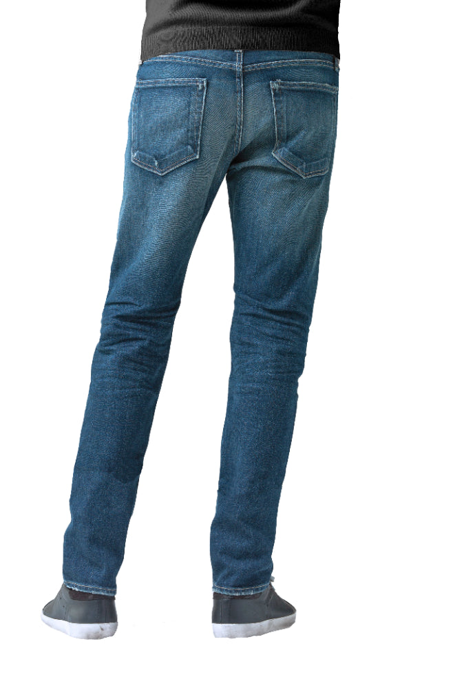 The back of S.M.N Studio's Hunter in Sundance Men's Jeans. A slim fit darker blue wash jean accented with contrasting fades and whiskers for a worn in look. It's made in a comfort stretch Japanese denim. 