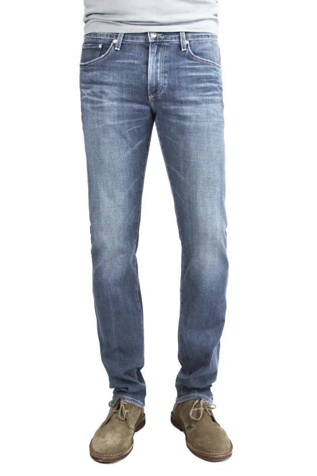 S.M.N Studio's Hunter in Kai Men's Jeans - A slim fit jean made up in a washed medium indigo color to create for a naturally worn-in casual and comfortable look with fading, honeycombs, and whiskering