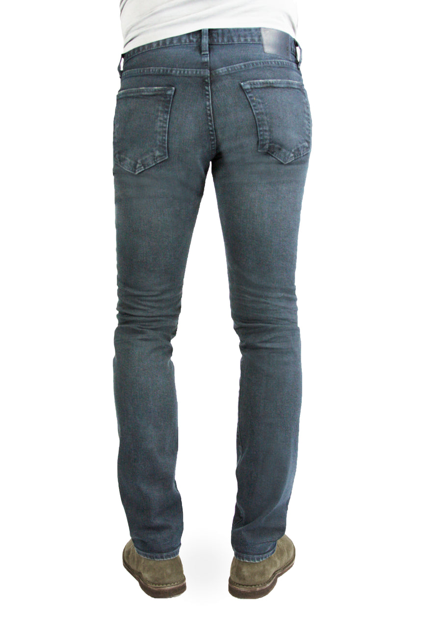 Back of S.M.N Studio's Hunter in Berlin Men's Jeans - Comfort stretch tapered slim fit jeans made in a blue grey colored comfort stretch Japanese denim and contrasted lightly with fading and whiskers for a vintage worn-in appeal