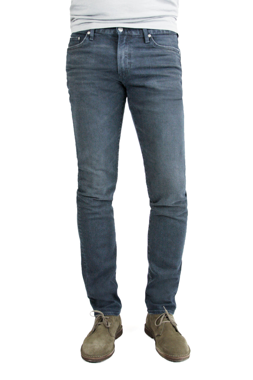 S.M.N Studio's Hunter in Berlin Men's Jeans - Comfort stretch tapered slim fit jeans made in a blue grey colored comfort stretch Japanese denim and contrasted lightly with fading and whiskers for a vintage worn-in appeal