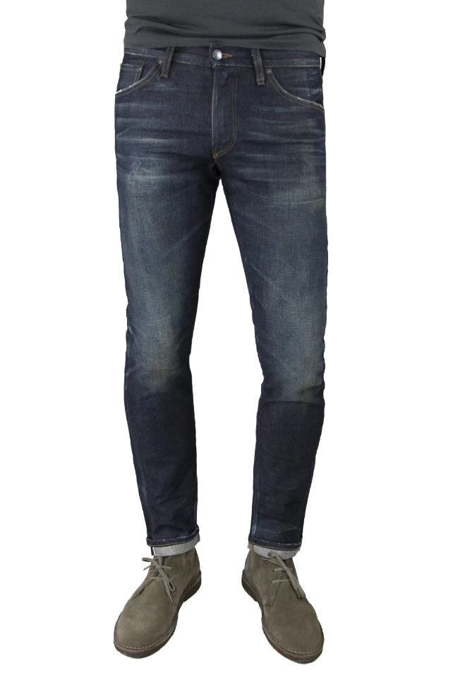 S.M.N Studio's Finn in Griffin Men's Jeans - Tapered slim jeans made in a premium stretch selvedge Japanese denim with a slightly worn-in raw denim wash  