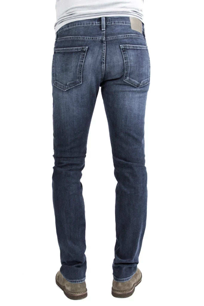 Back of S.M.N Studio's Hunter in Atlas Men's Jeans - Dark to medium indigo wash made up in a comfort stretch denim with light fading and 3D whiskering to create a broken-in look