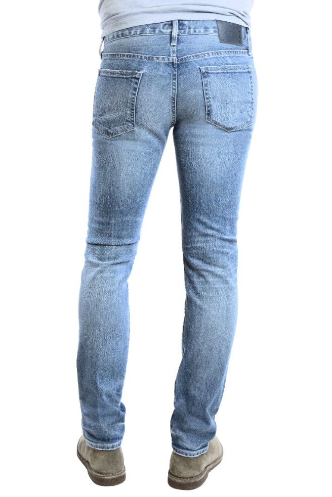 Back of S.M.N Studio's Finn in Maison Men's Jeans - Tapered Slim Light blue comfort stretch premium denim with whiskering and fades for a natural lived in wash 