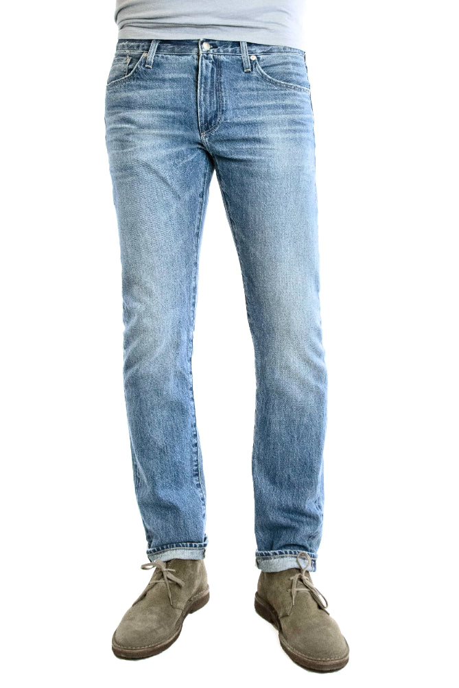S.M.N Studio's Hunter in Mayfair Men's Jeans. A comfortable stretch selvedge light wash Japanese denim finished with fades, honeycombs, and whiskering