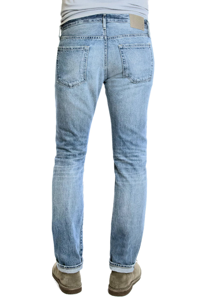 Back of S.M.N Studio's Hunter in Mayfair Men's Jeans. A comfortable stretch selvedge light wash Japanese denim finished with fades, honeycombs, and whiskering