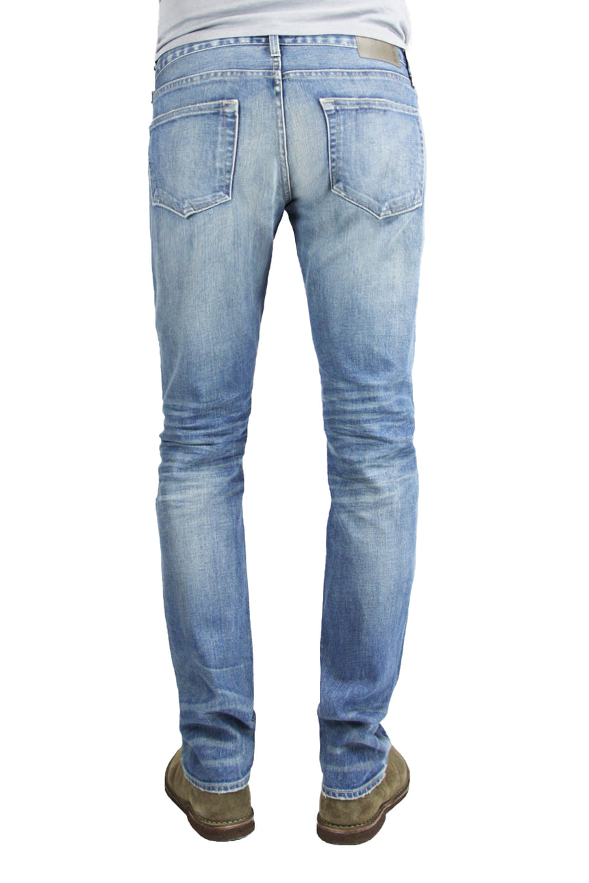Back of S.M.N Studio's Finn in Western Men's Jeans - Tapered Slim Comfort Stretch Denim in vintage light wash denim accented with fading and whiskering