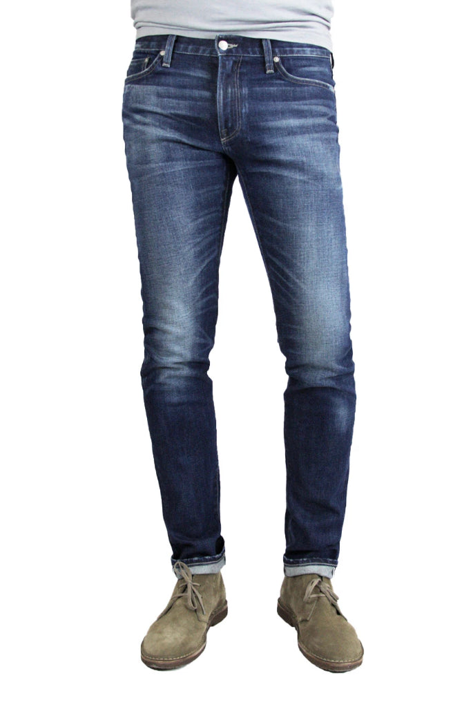 S.M.N Studio's Finn in Matteo Men's Jeans - Tapered slim fit jean in comfort stretch premium Japanese selvedge denim in a dark blue wash with contrasting fades 