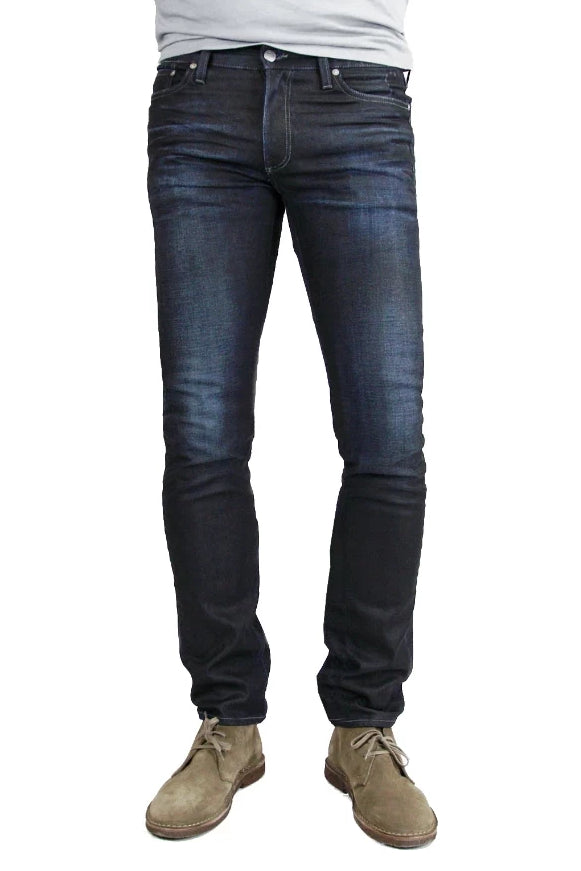 S.M.N Studio's Hunter in Empire Men's Jeans - Slim fit jeans made up in a premium comfort stretch denim with a dark indigo wash characterized by light contrast fades, accented 3D whiskers, and honeycombs