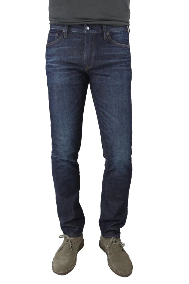 S.M.N Studio's Hunter in Dean Men's Jeans - Slim fit jeans in a dark indigo denim wash with slight contrast fades, 3d whiskering, and honeycombs to replicate a natural worn look