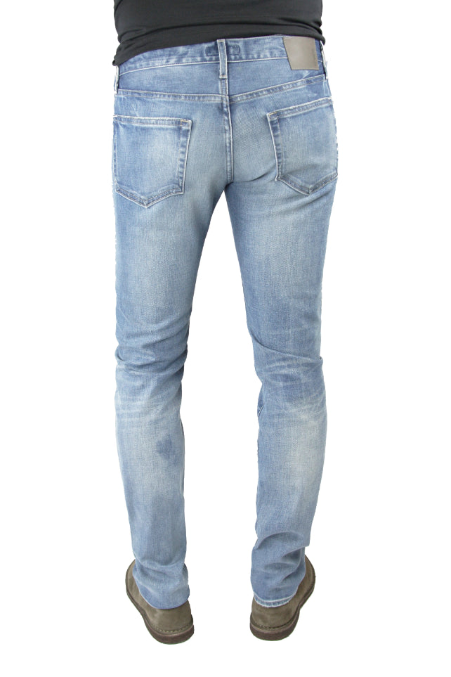 Back of S.M.N Studio's Hunter in Zinc Men's Jeans -  Slim fit light indigo washed denim faded with light rip details on thigh and in comfort stretch denim