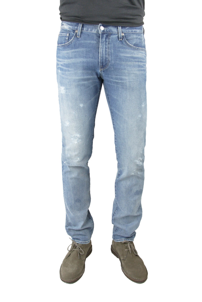 S.M.N Studio's Hunter in Zinc Men's Jeans -  Slim fit light indigo washed denim faded with light rip details on thigh and in comfort stretch denim